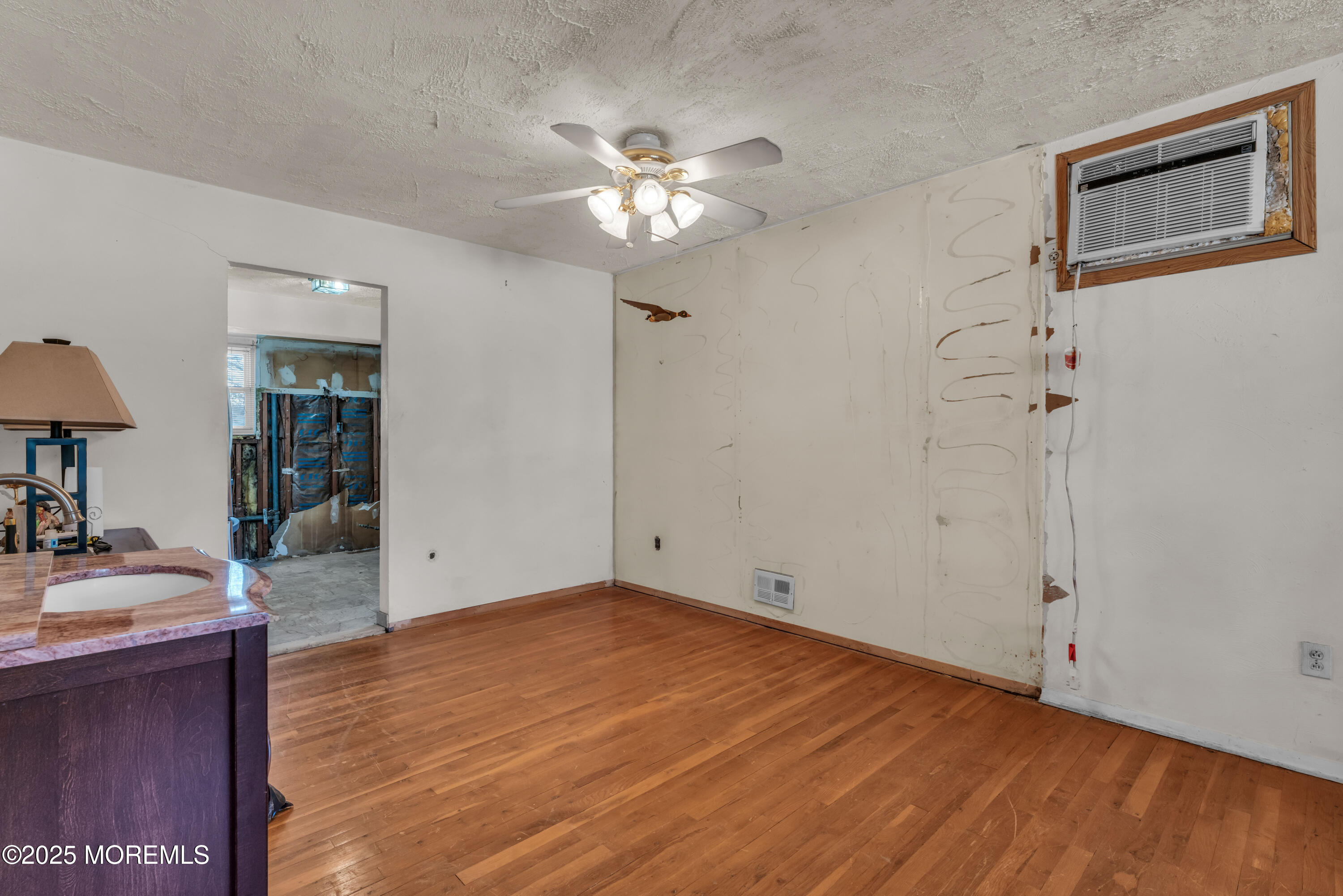 975 South Concourse Keyport, NJ 07735 - Photo 18 of 46 a view of a livingroom with a chandelier fan and wooden floor