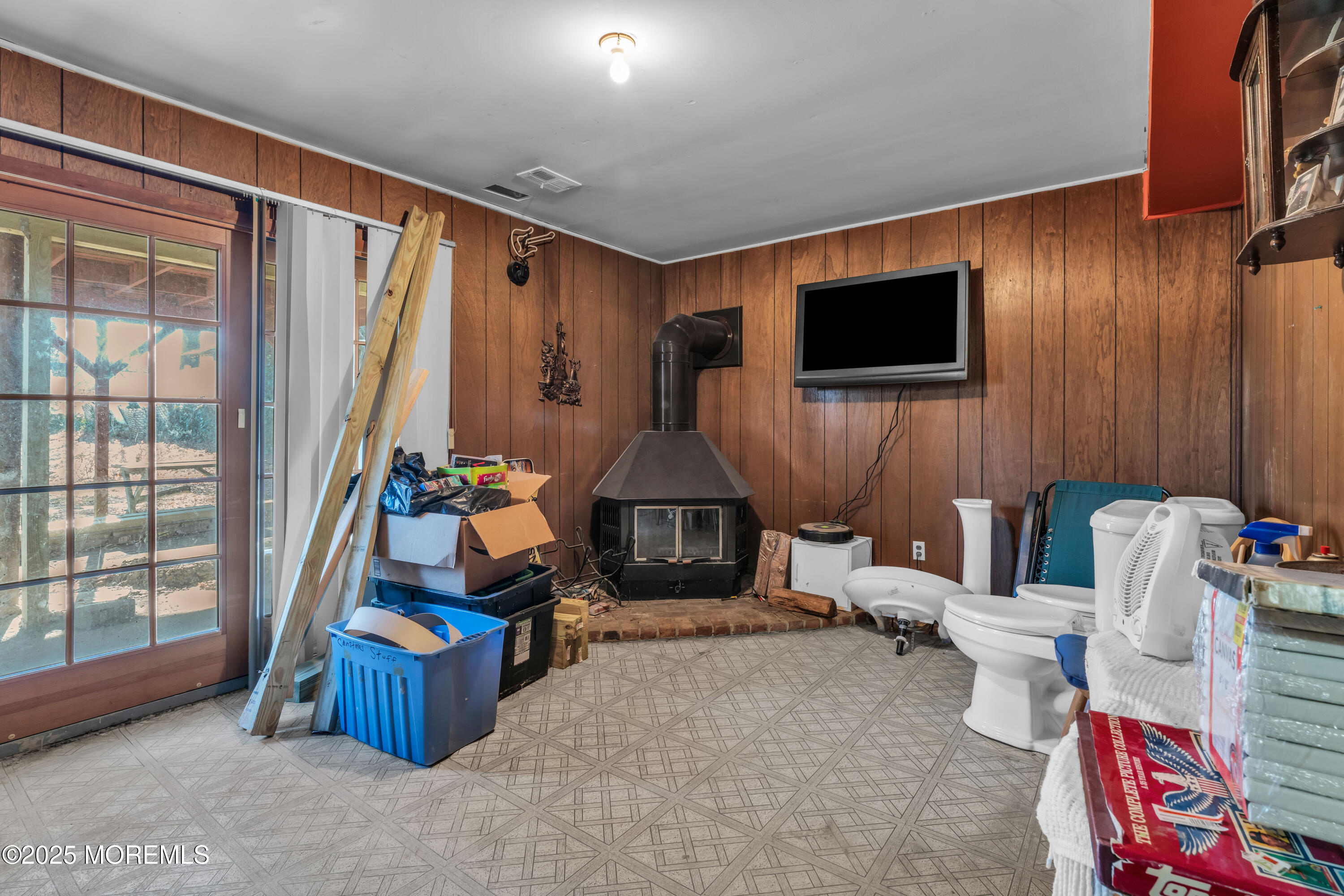 975 South Concourse Keyport, NJ 07735 - Photo 23 of 46 a living room with furniture a flat screen tv and a floor to ceiling window
