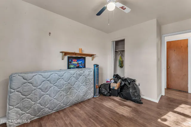 a view of a livingroom with furniture and gym equipment