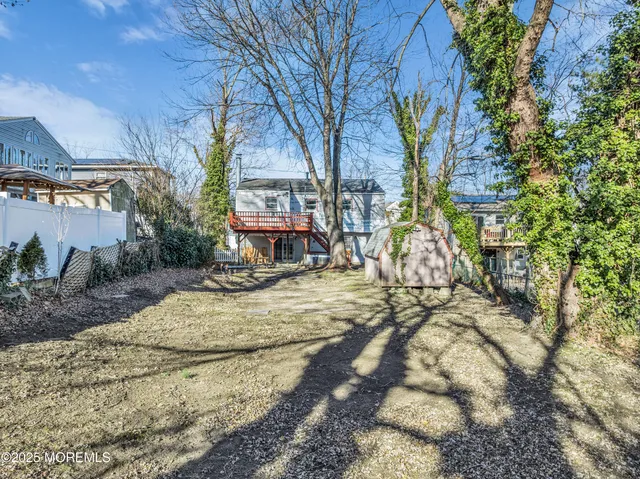 a view of a house with a yard covered in snow