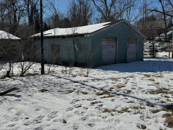 a house with trees in the background