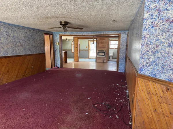 wooden floor in an empty room with a fireplace