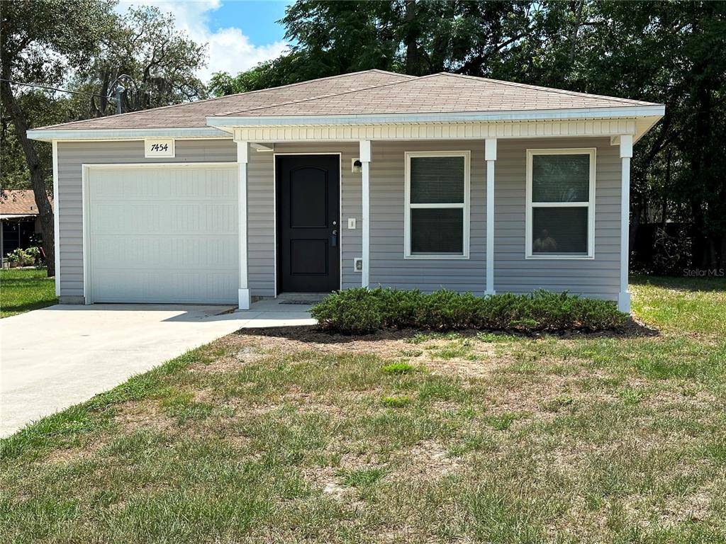 7454 Mohawk Trail Spring Hill, FL 34606 - Photo 1 of 1 Front with nice porch