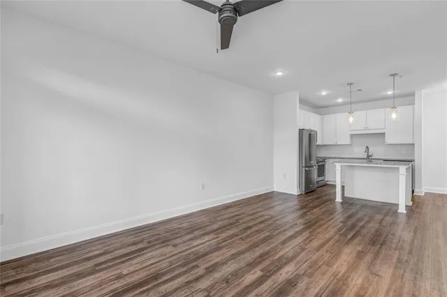 a view of kitchen refrigerator and microwave