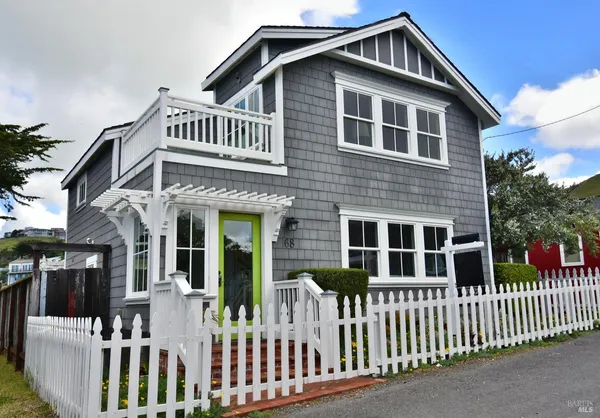 a front view of a house with a porch