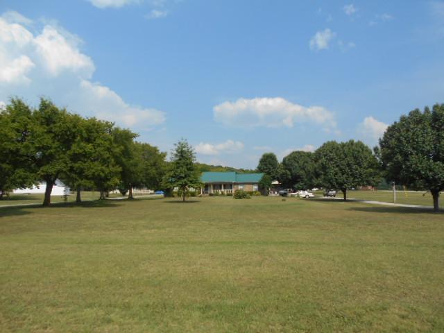 1422 Springplace Road Lewisburg, TN 37091 - Photo 2 of 19 Main house (1422 Spring Place RD) and guest house (1418 Spring Place RD) sit on over five acres! Two-car garage, carport, shed, decks, mother-in-law suite, and much MORE!