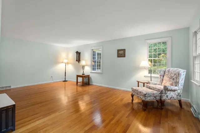 a view of a livingroom with furniture and wooden floor