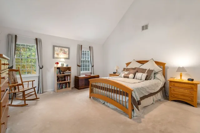 a bedroom with bed and a window