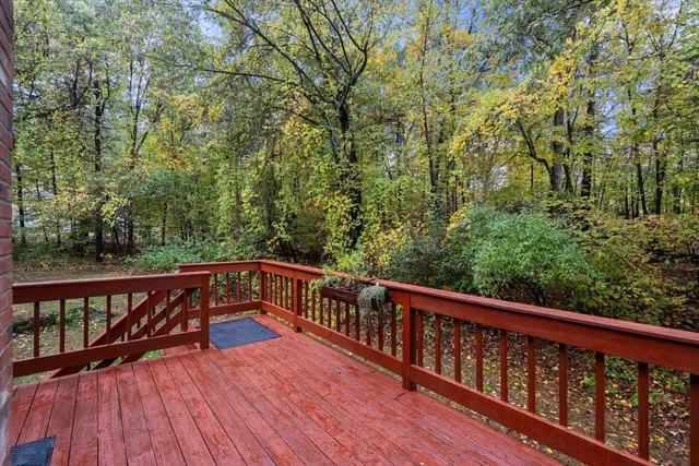 a view of balcony with deck and wooden floor