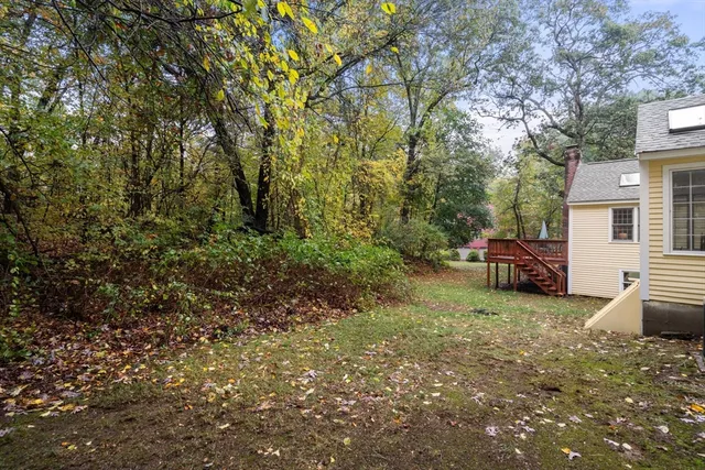 a view of a backyard with parked area