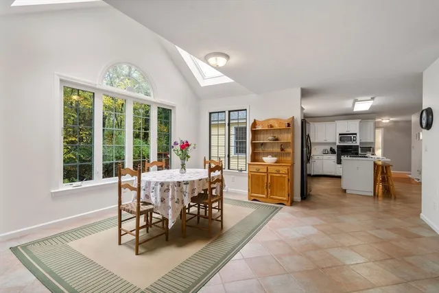 a view of a dining room with furniture window and outside view