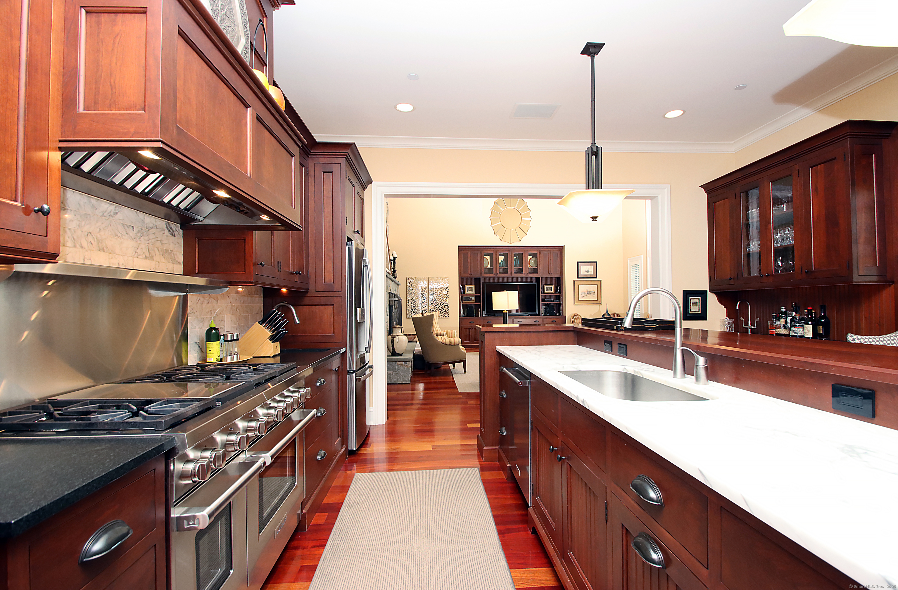 25 Sky View Drive Avon, CT 06001 - Photo 13 of 40 a kitchen with stainless steel appliances granite countertop a stove a sink and a microwave