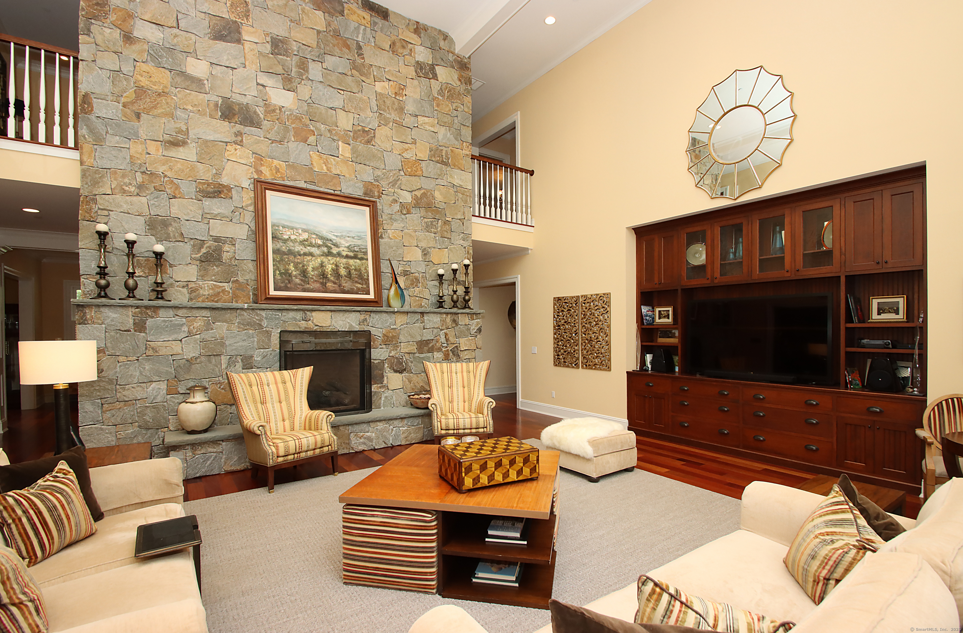 25 Sky View Drive Avon, CT 06001 - Photo 19 of 40 a living room with furniture and a flat screen tv