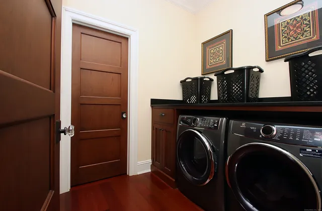 a view of storage and utility room with washer and dryer