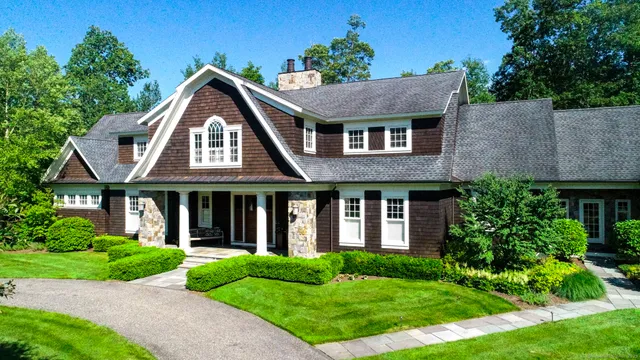 front view of brick house with a yard