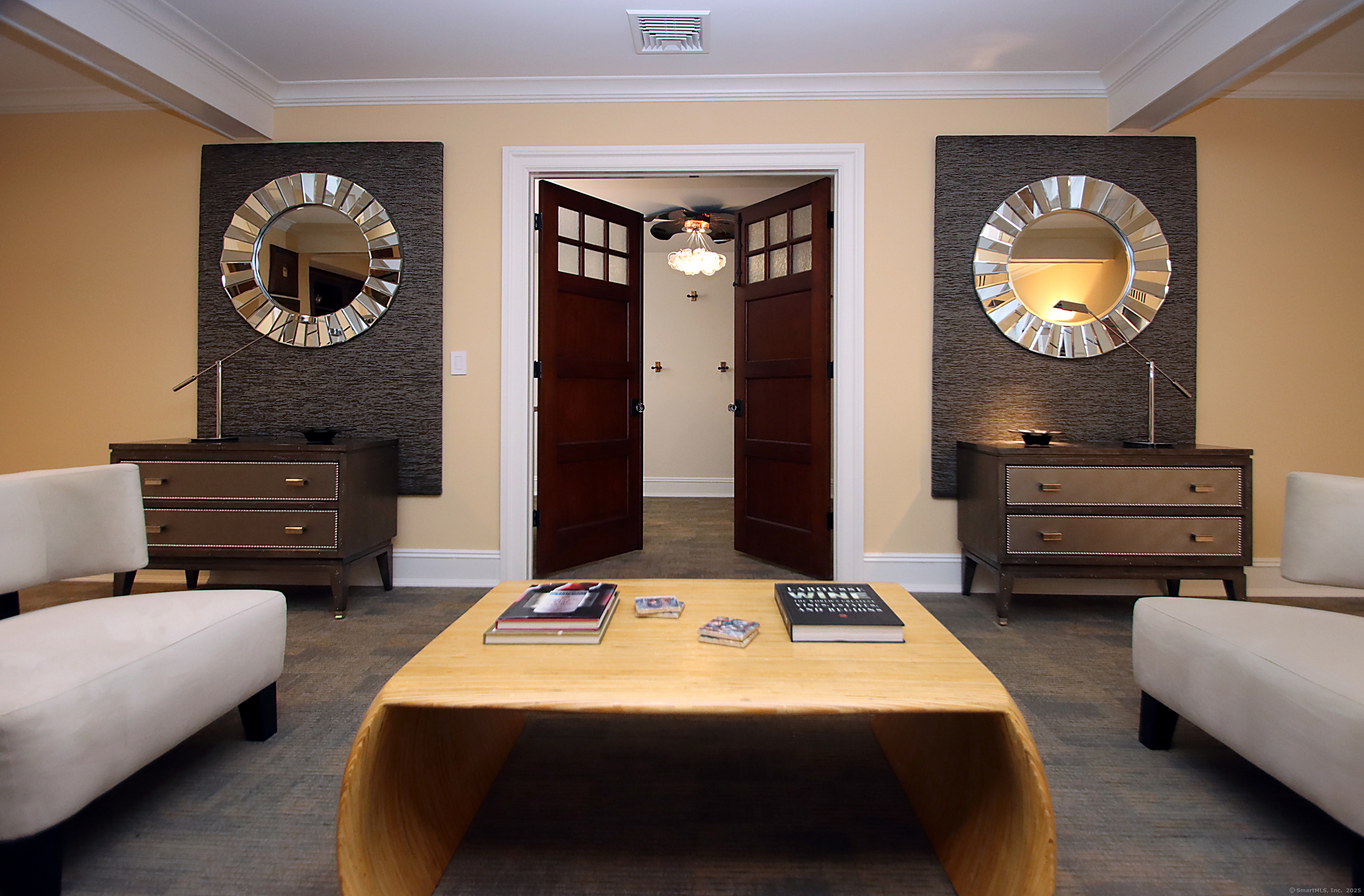 25 Sky View Drive Avon, CT 06001 - Photo 33 of 40 a bedroom with bed and a chandelier