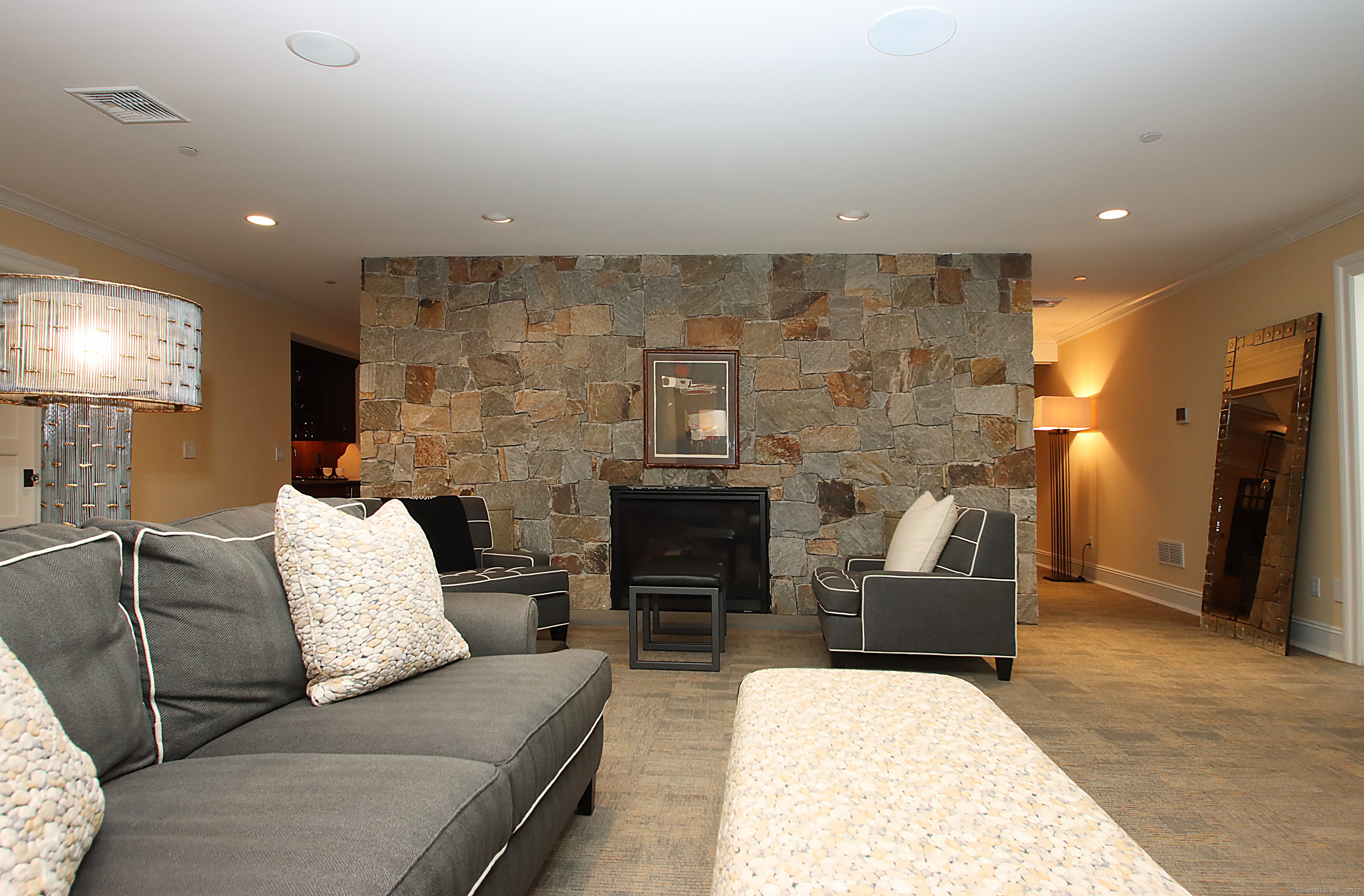 25 Sky View Drive Avon, CT 06001 - Photo 34 of 40 a living room with furniture and a fireplace