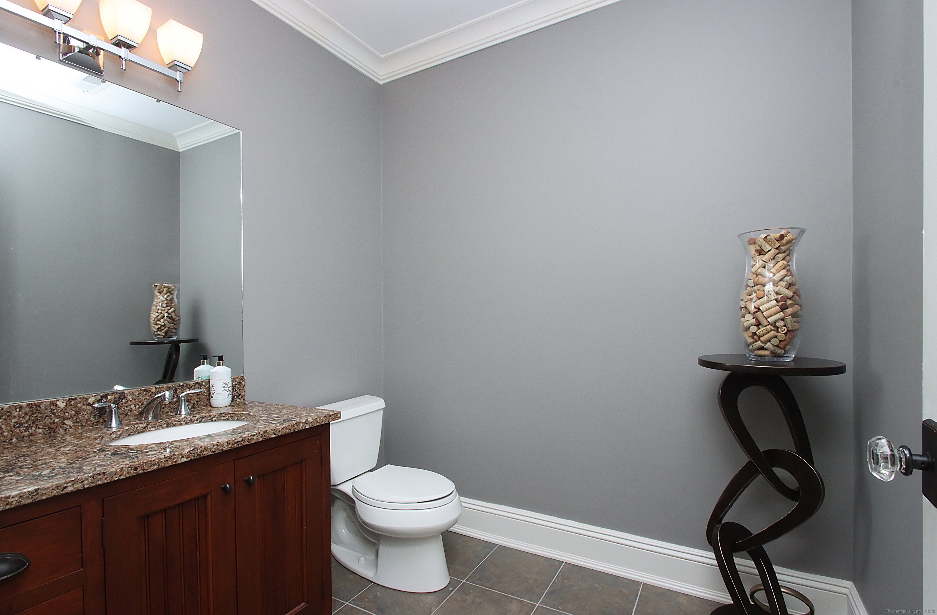 25 Sky View Drive Avon, CT 06001 - Photo 36 of 40 a bathroom with a toilet sink and mirror