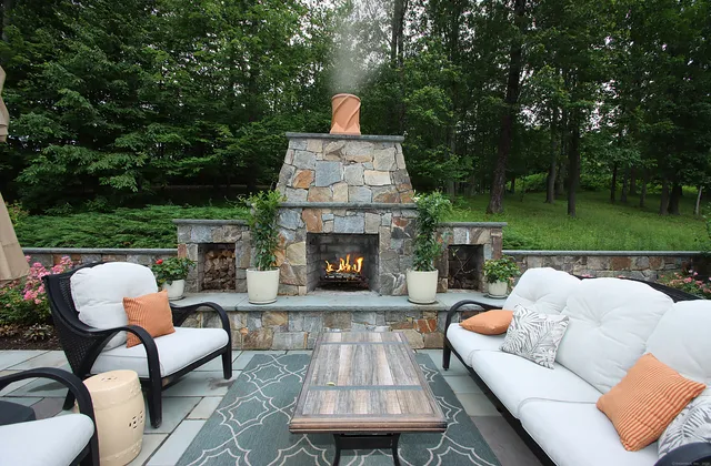 a view of a patio with couches chairs and a fire pit