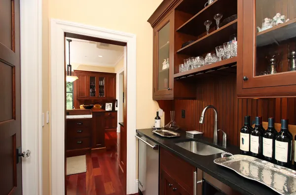 a dining room with furniture and wooden floor