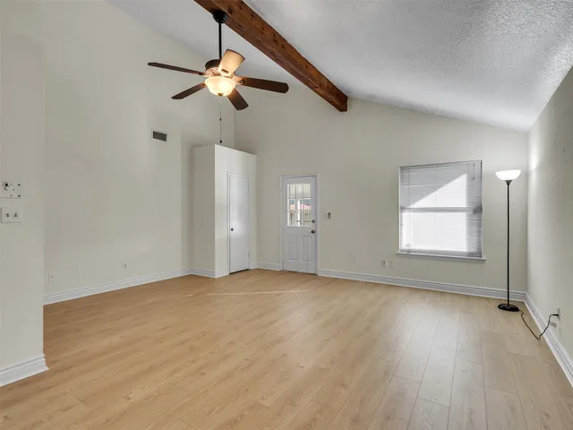 an empty room with fan