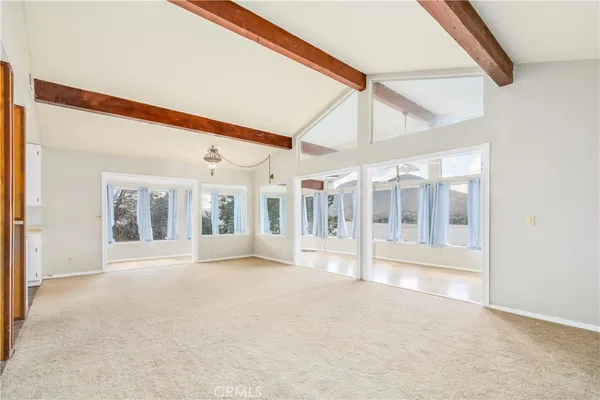 a bathroom with a sink mirror and a shower