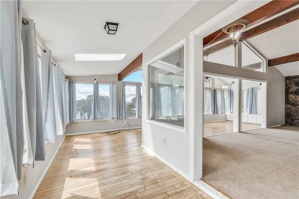 a bathroom with a sink a toilet and a window