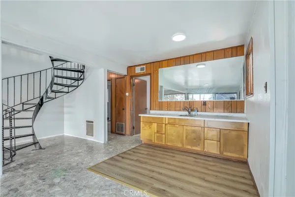 a view of a yard with plants and tree