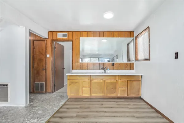 a bathroom with a sink and mirror