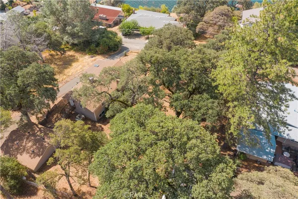 a view of a lake with houses in the back