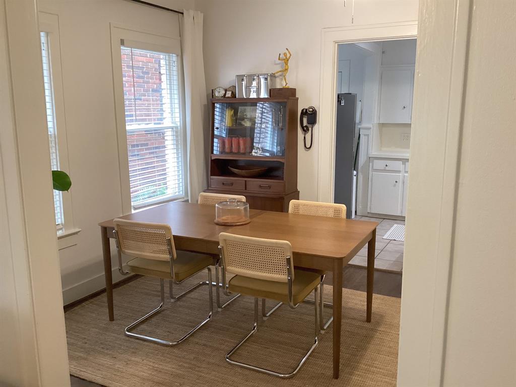 4034 Hawthorne Avenue, Unit 103 Dallas, TX 75219 - Photo 4 of 13 a view of a dining room with furniture and window