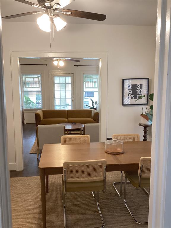 4034 Hawthorne Avenue, Unit 103 Dallas, TX 75219 - Photo 5 of 13 a view of a dining room with furniture and chandelier