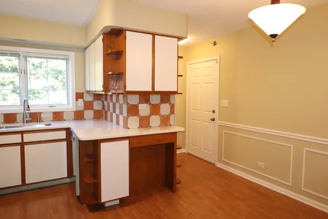 a kitchen with a sink and a window