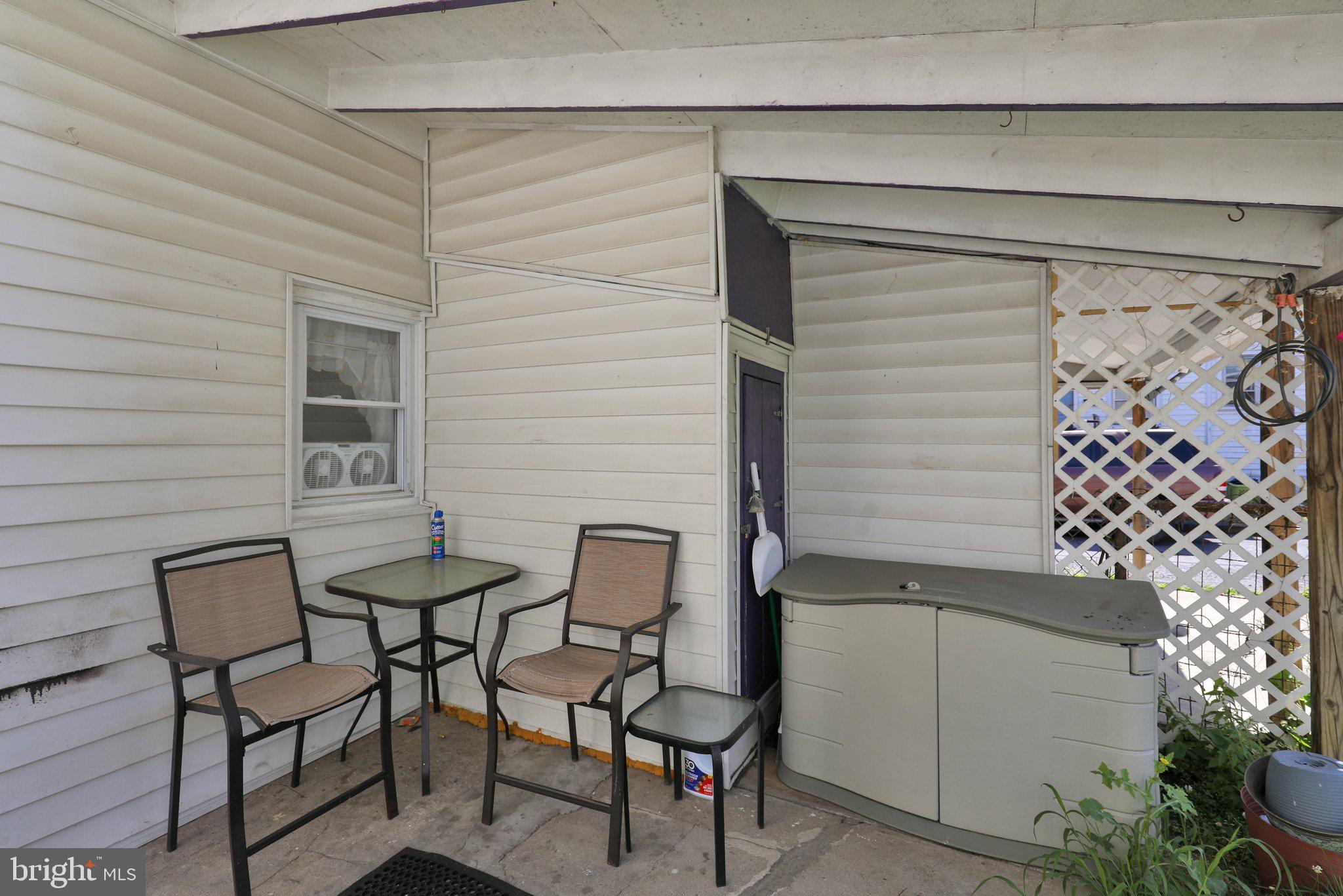 1122 Buttonwood Street Reading, PA 19604 - Photo 18 of 18 a view of chairs and table in front of door