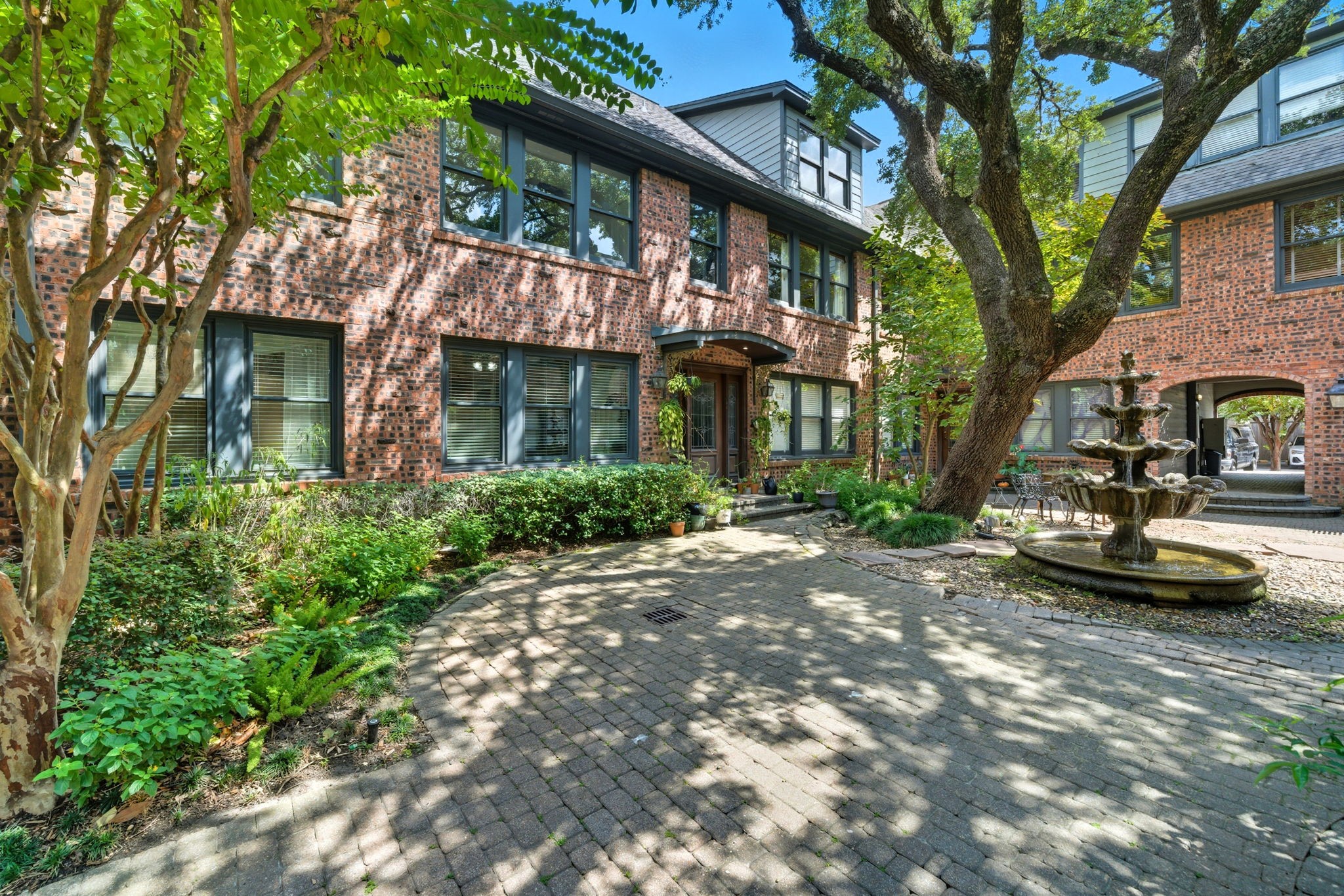 3015 Chenevert Street, Unit 1 Houston, TX 77004 - Photo 2 of 10 a view of a patio with table and chairs and potted plants