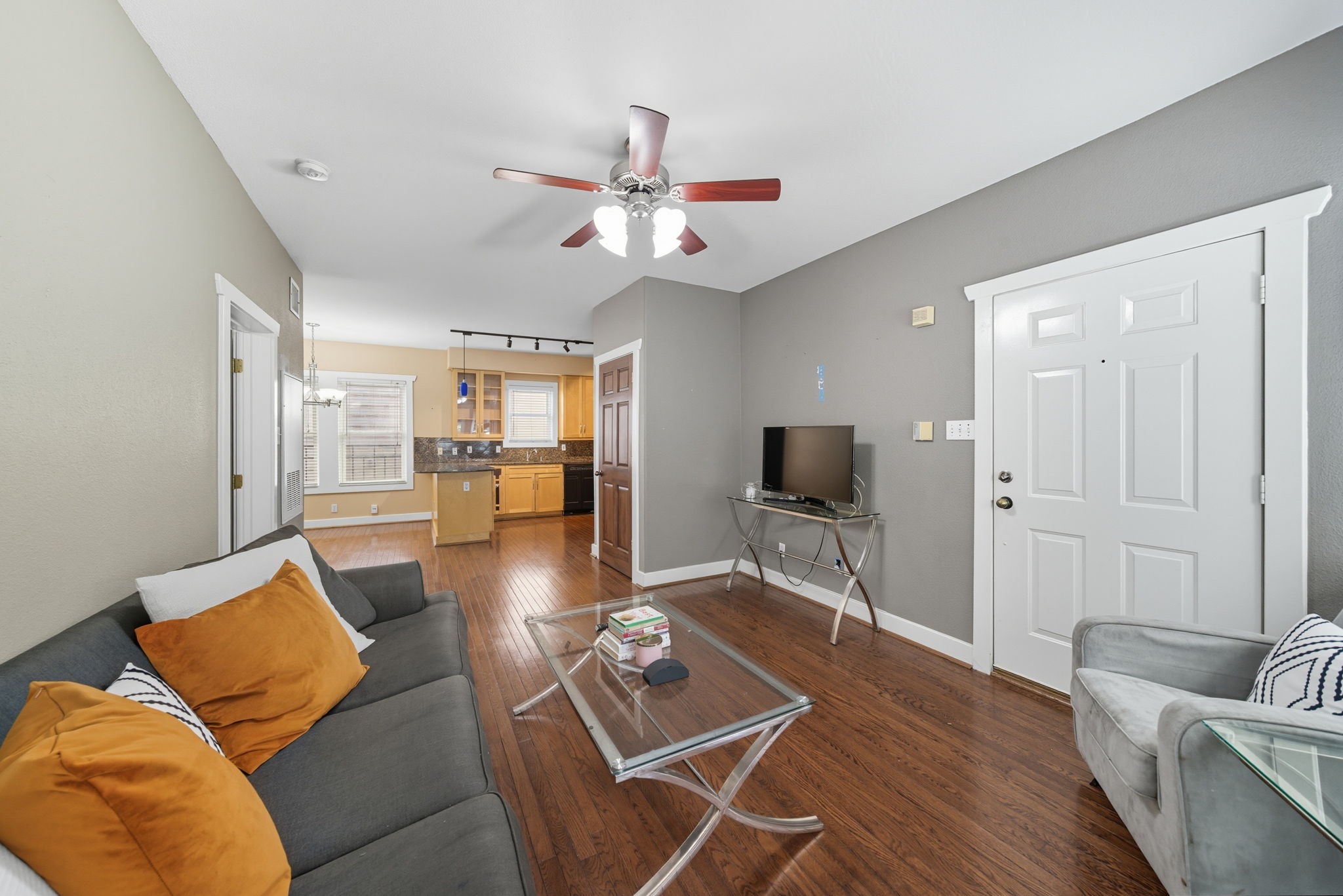3015 Chenevert Street, Unit 1 Houston, TX 77004 - Photo 5 of 10 a living room with furniture and wooden floor
