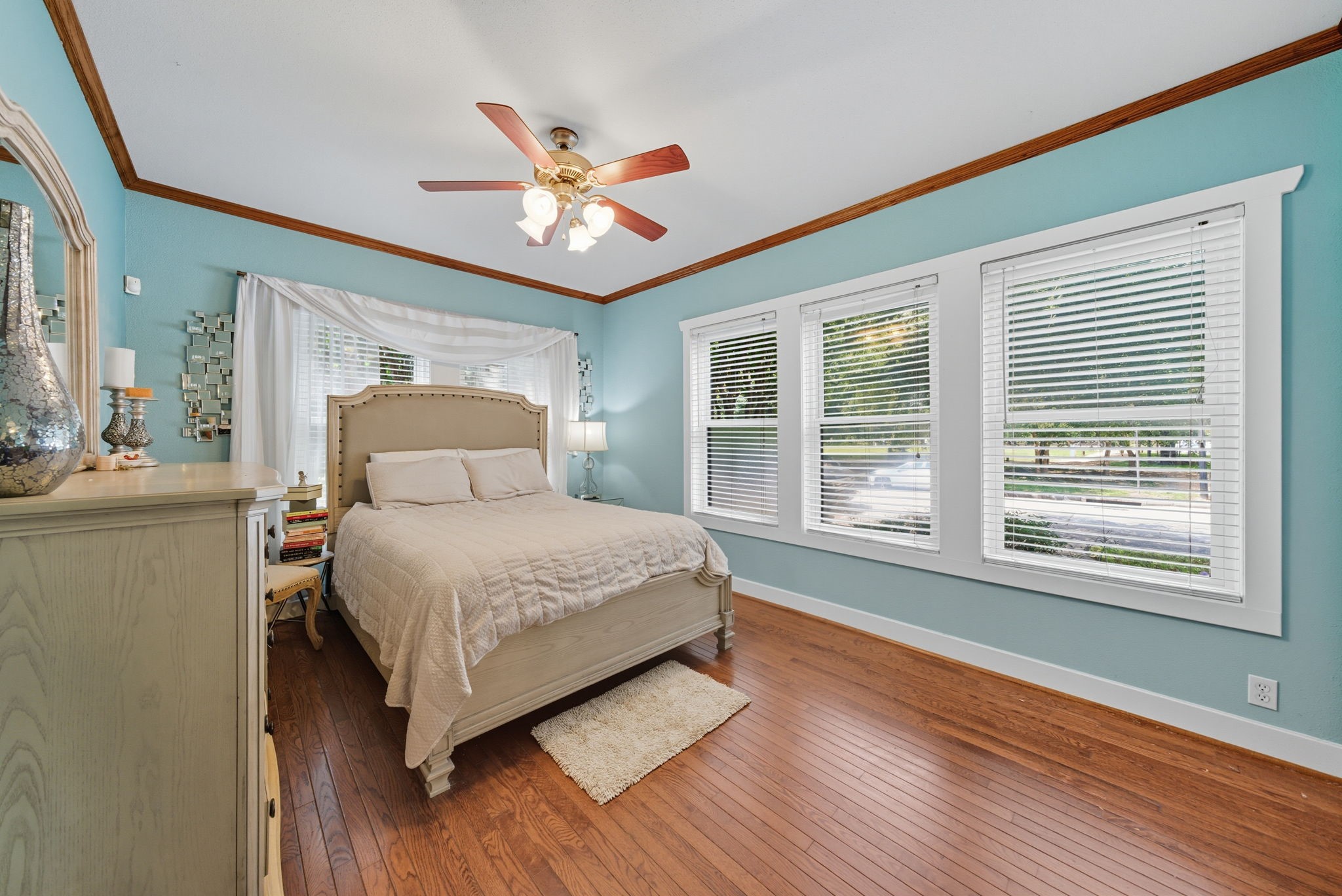 3015 Chenevert Street, Unit 1 Houston, TX 77004 - Photo 8 of 10 a bedroom with a large bed and a window