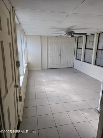 a view of entryway with stairs and a window
