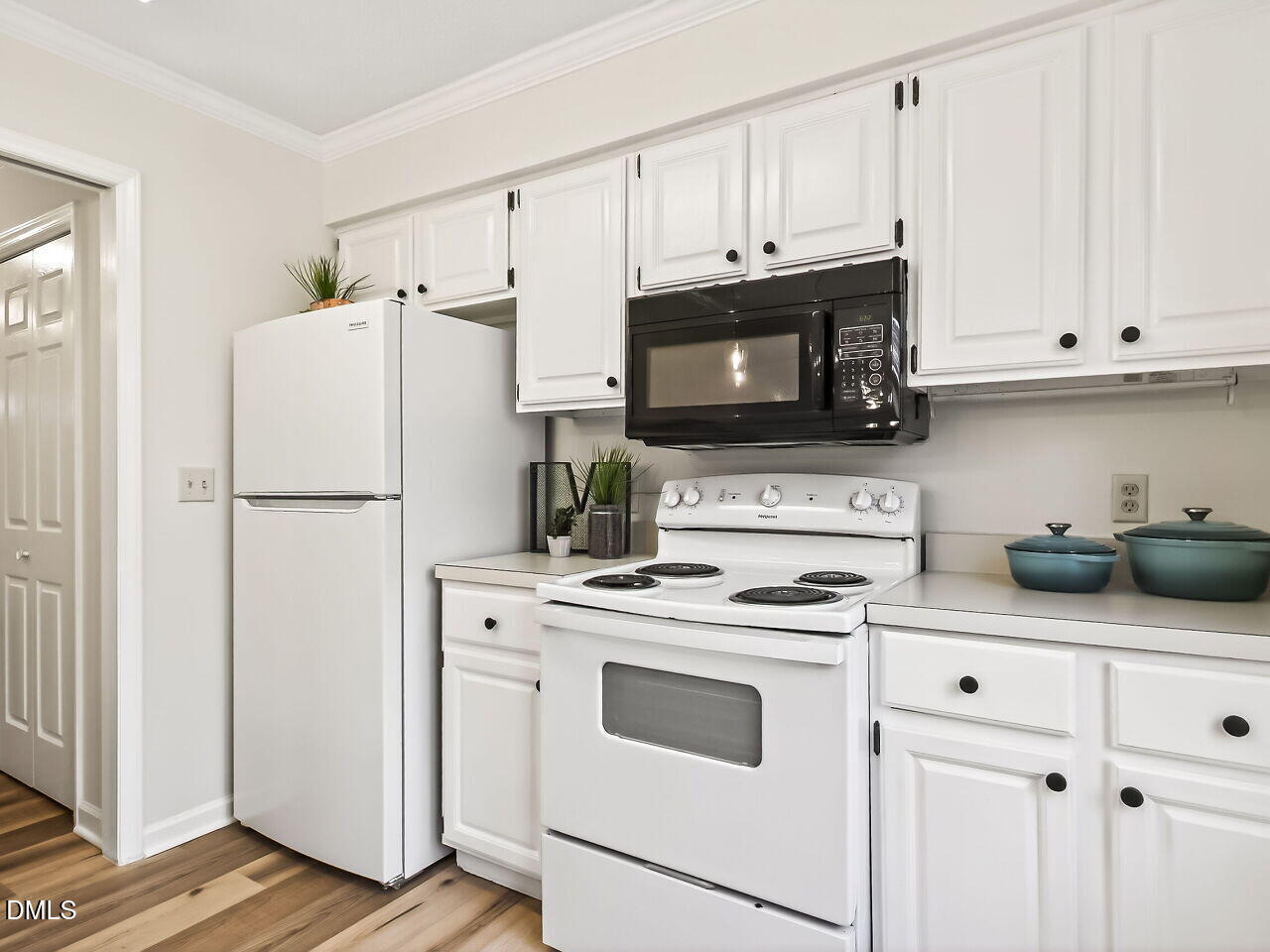 3204 Coachman's Way Durham, NC 27705 - Photo 12 of 27 a kitchen with cabinets stainless steel appliances and a counter space
