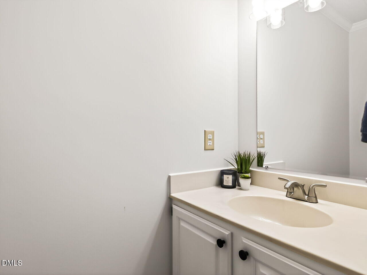 3204 Coachman's Way Durham, NC 27705 - Photo 14 of 27 a bathroom with a sink and a mirror