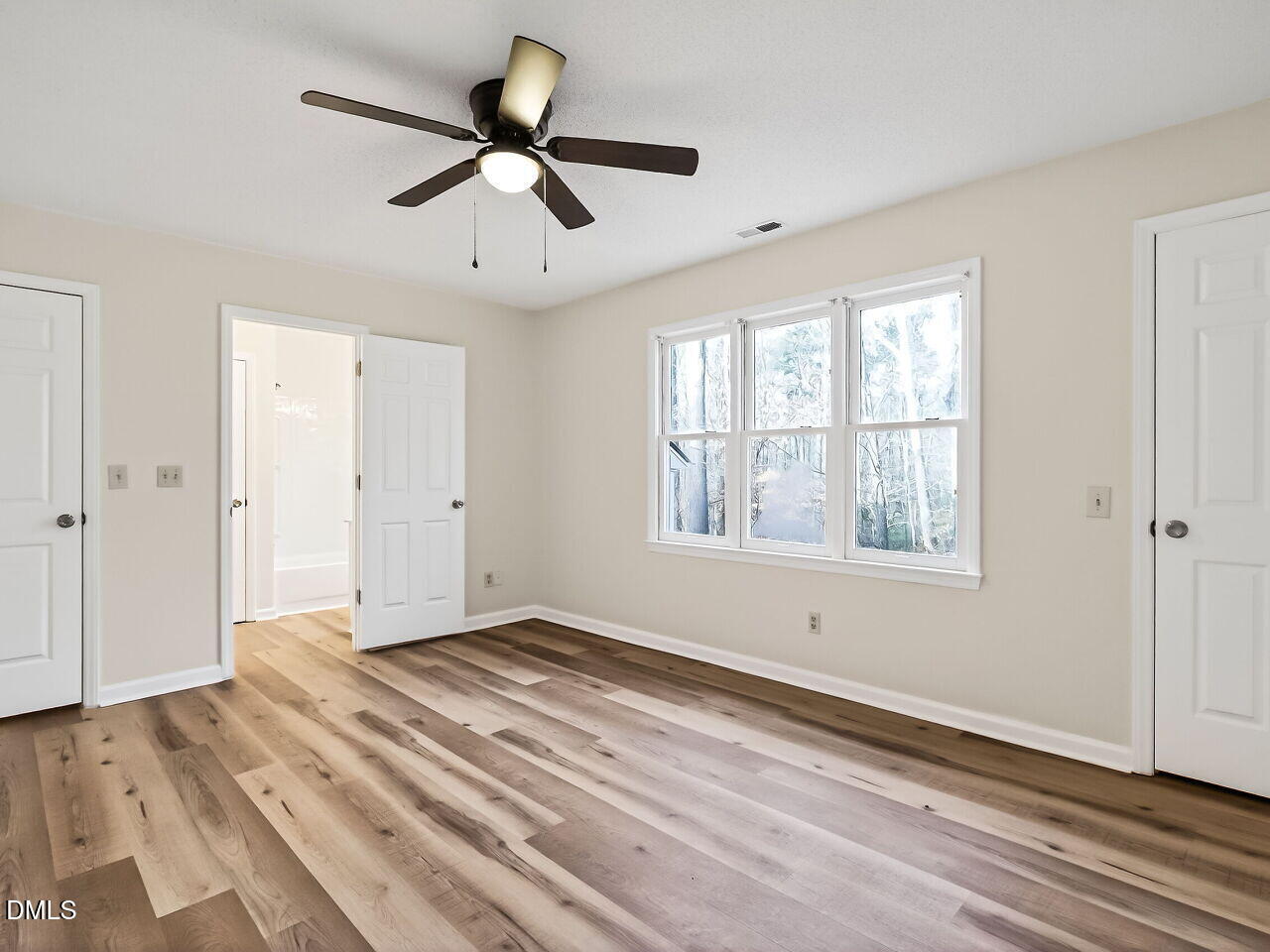 3204 Coachman's Way Durham, NC 27705 - Photo 16 of 27 a view of an empty room with wooden floor and a window