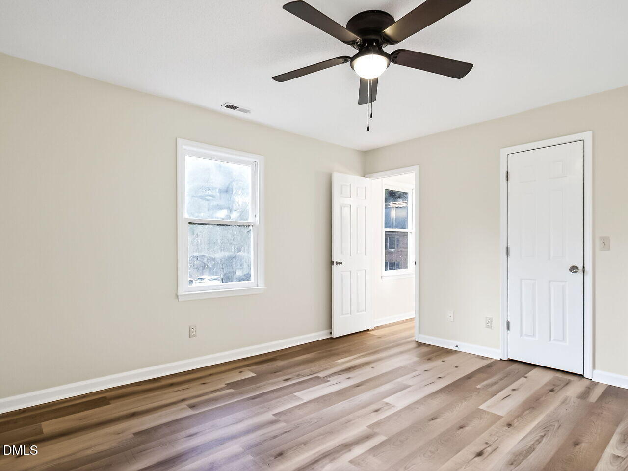 3204 Coachman's Way Durham, NC 27705 - Photo 20 of 27 a view of an empty room with wooden floor and a window