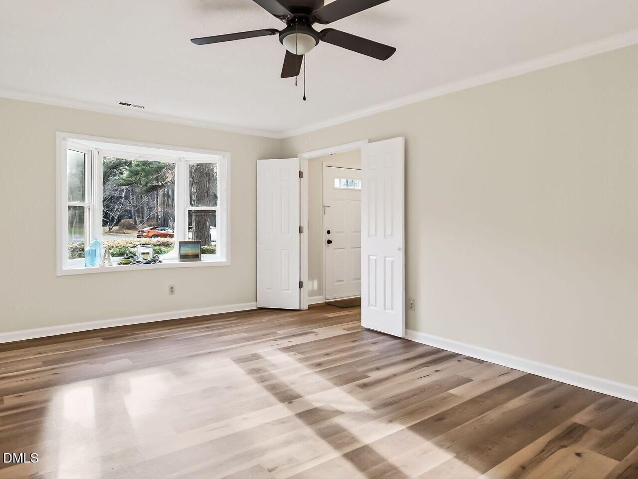 3204 Coachman's Way Durham, NC 27705 - Photo 7 of 27 an empty room with fan and windows