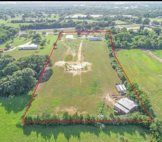 a view of a lake with a yard and outdoor seating
