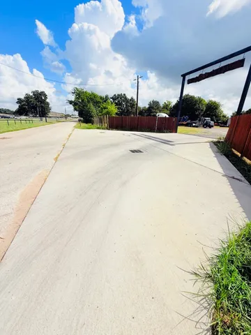 a view of an outdoor space and basketball court