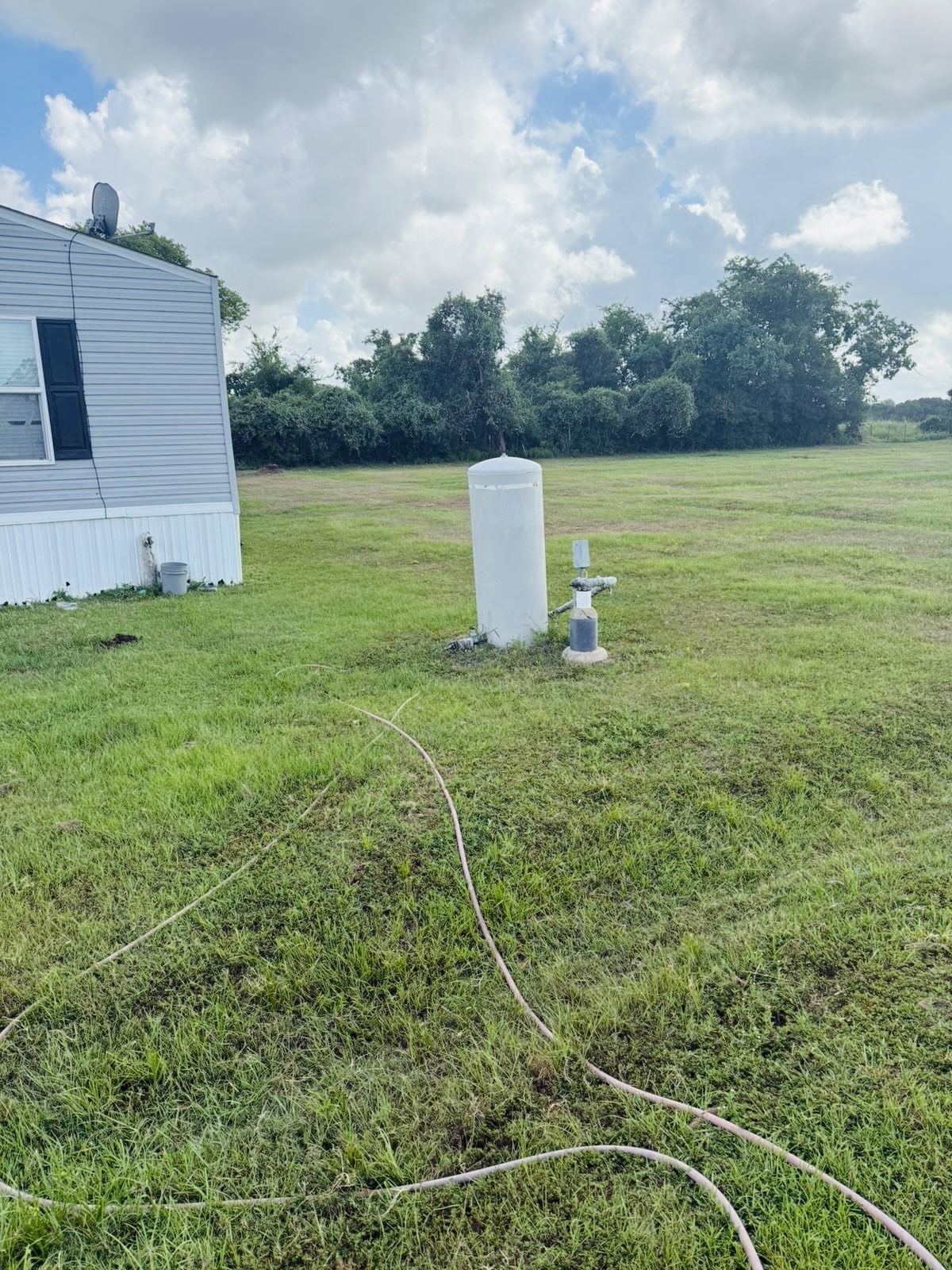 21728 Fairground Road Hempstead, TX 77445 - Photo 5 of 23 a view of a field with wooden fence