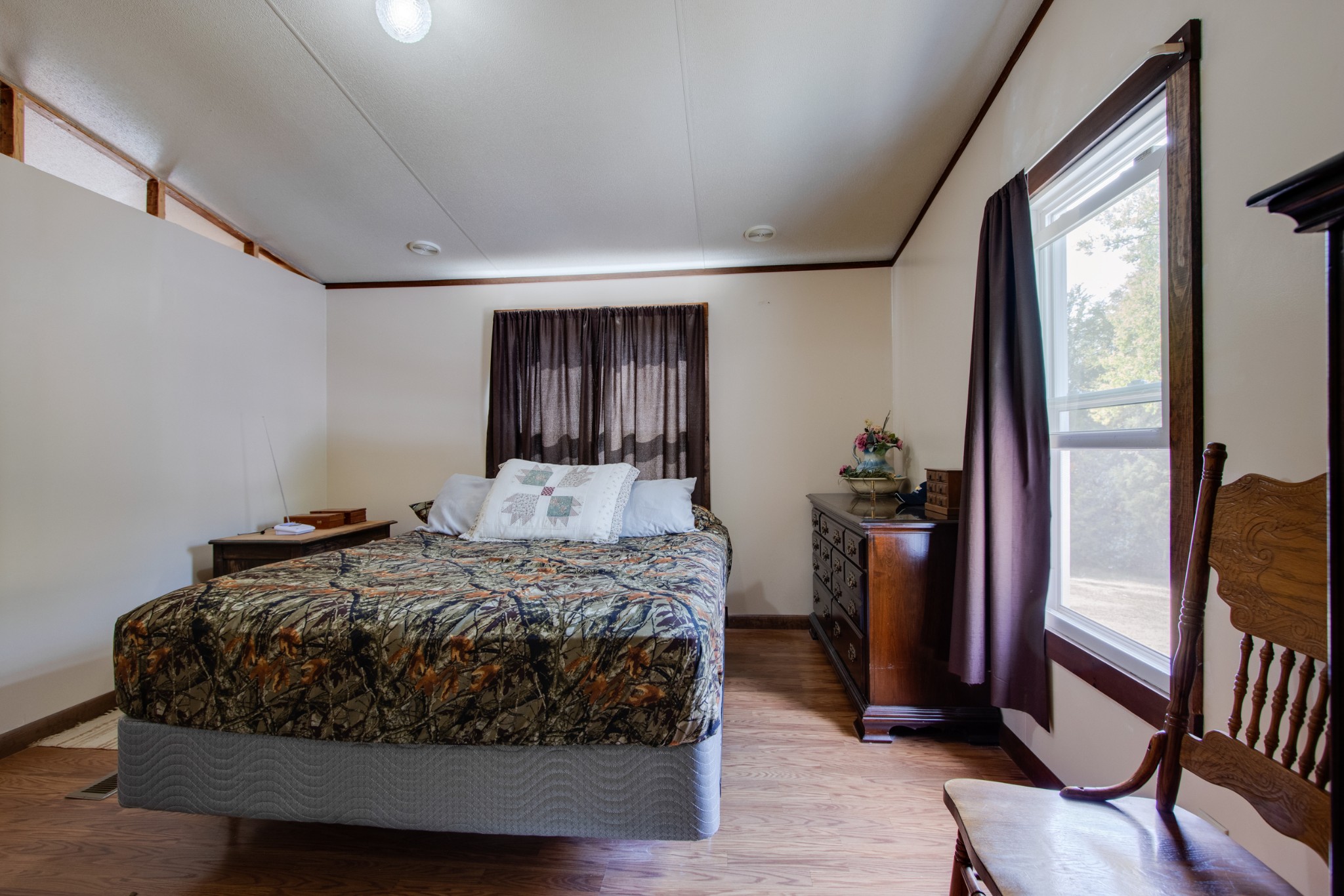 745 Holloway Road Lebanon, TN 37090 - Photo 11 of 30 a bedroom with a bed and a mirror
