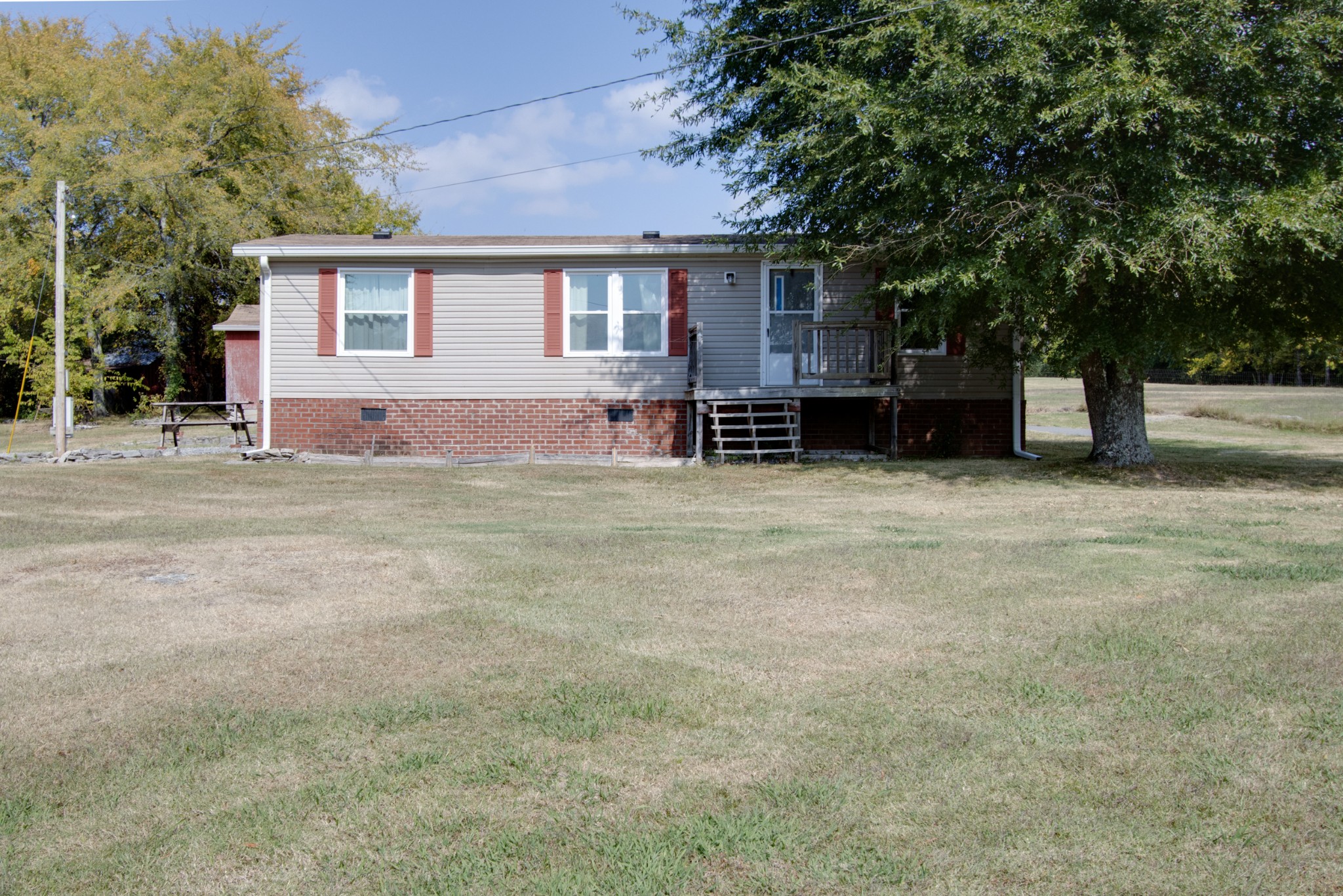 745 Holloway Road Lebanon, TN 37090 - Photo 2 of 30 a view of a house with a yard and large tree