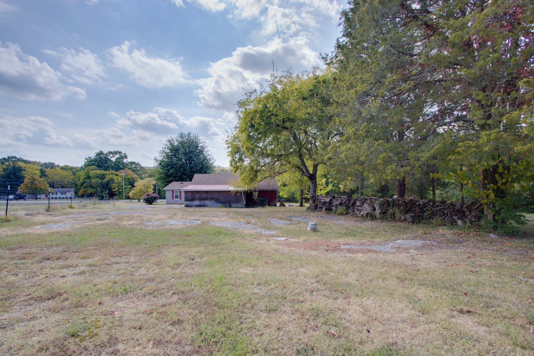 745 Holloway Road Lebanon, TN 37090 - Photo 27 of 30 a backyard of a house with a yard and garage