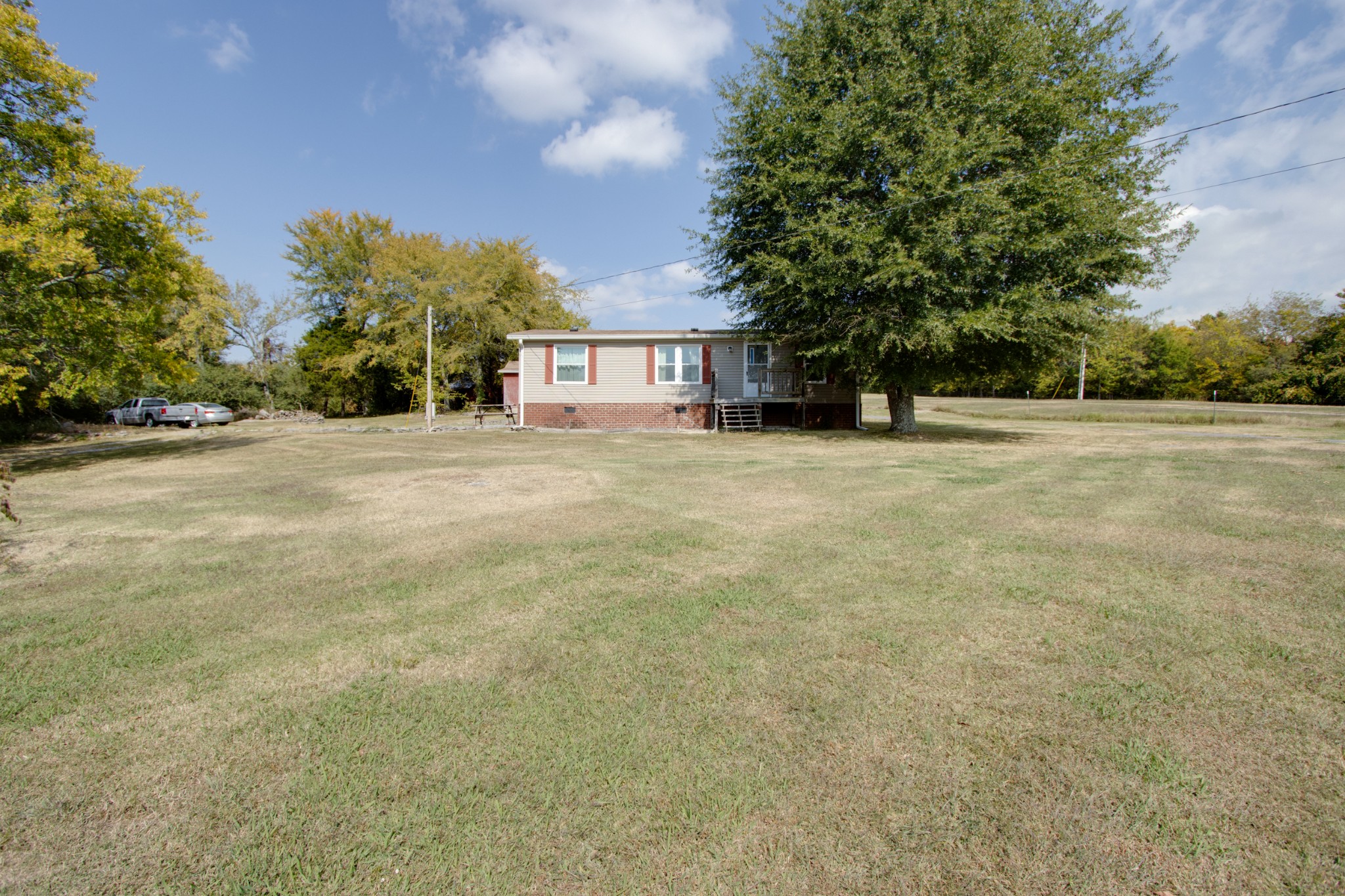 745 Holloway Road Lebanon, TN 37090 - Photo 3 of 30 a view of a house with a yard and garage